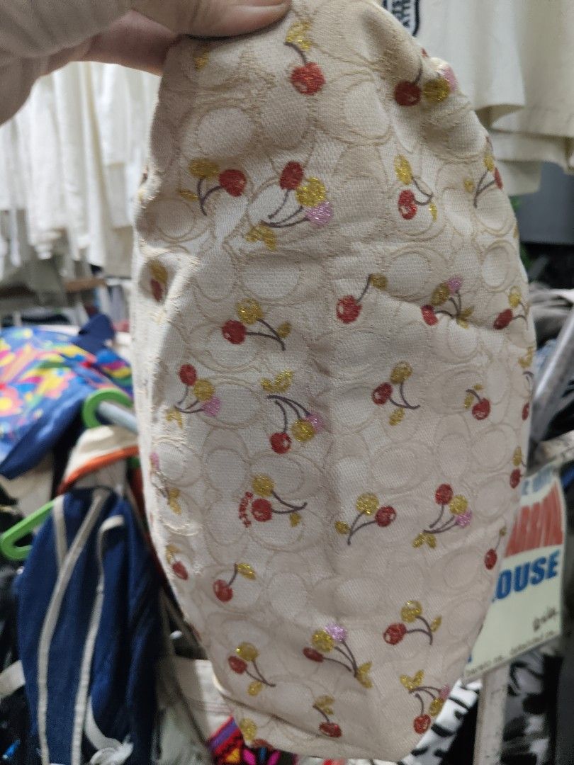Coach Cherry Print Tote Bag Cream (Category: Tote Bags) located in Manila. Submitted by cosmicgem.54b13d (Listing ID 1469600202, Image 1). Description: - Authentic Coach tote bag in cream - Cute all-over cherry pattern with glitter details - Secure zip-top closure - Sturdy fabric handles and pink shoulder straps - Spacious brown fabric-lined interior with Coach tag - Roomy enough for all your daily essentials.