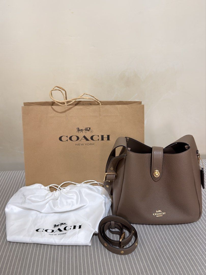 Coach Hadley Convertible Crossbody Bag (Category: Shoulder Bags) located in San Mateo. Submitted by ktrnugh (Listing ID 1469627897, Image 1). Description: For sale: Coach Hadley Convertible Crossbody Bag (regular size) Color: Dark Stone 🏷️ Price is negotiable Condition: Very good - lightly used - Bought from Coach outlet / authentic - Comes with crossbody strap, paper bag, and original Coach dustbag (bought separately) RFS: Decluttering 📍Batasa