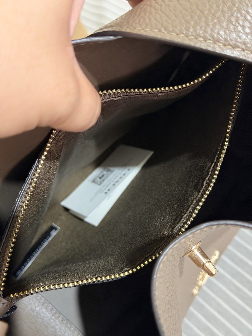 Coach Hadley Convertible Crossbody Bag (Category: Shoulder Bags) located in San Mateo. Submitted by ktrnugh (Listing ID 1469627897, Image 3). Description: For sale: Coach Hadley Convertible Crossbody Bag (regular size) Color: Dark Stone 🏷️ Price is negotiable Condition: Very good - lightly used - Bought from Coach outlet / authentic - Comes with crossbody strap, paper bag, and original Coach dustbag (bought separately) RFS: Decluttering 📍Batasa