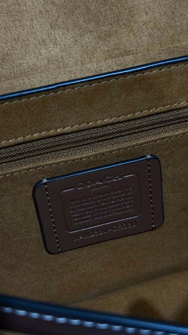 Coach Hutton Canvas Shoulder Bag (Category: Shoulder Bags) located in Cavite. Submitted by loriojenni09117 (Listing ID 1469712868, Image 2). Description: - Coach shoulder/crossbody bag - Beige canvas body with durable brown leather trim - Elegant gold-tone hardware with engraved Coach logo pushlock closure - Spacious interior with multiple compartments and a secure zip pocket - Soft brown suede-like lining - Adjustable strap for shoulder or cross