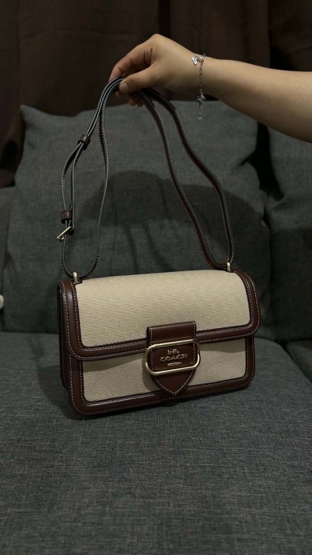 Coach Hutton Canvas Shoulder Bag (Category: Shoulder Bags) located in Cavite. Submitted by loriojenni09117 (Listing ID 1469712868, Image 1). Description: - Coach shoulder/crossbody bag - Beige canvas body with durable brown leather trim - Elegant gold-tone hardware with engraved Coach logo pushlock closure - Spacious interior with multiple compartments and a secure zip pocket - Soft brown suede-like lining - Adjustable strap for shoulder or cross
