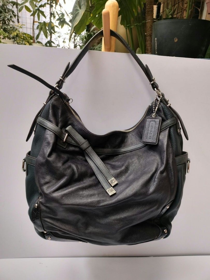 Coach Leather Hobo Bag Dark Green (Category: Luxury Bags & Wallets) located in Baguio. Submitted by galdzz_23 (Listing ID 1469661946, Image 1). Description: - Brand: Coach - Color: Dark green leather with vibrant emerald green satin lining - Hardware: Silver-tone with Coach embossed side logo - Details: Signature hangtag and chic decorative bow strap - Interior: Includes zipper and slip pockets for organization - Design: Comfortable single should