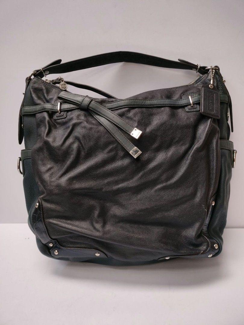 Coach Leather Hobo Bag Dark Green (Category: Luxury Bags & Wallets) located in Baguio. Submitted by galdzz_23 (Listing ID 1469661946, Image 3). Description: - Brand: Coach - Color: Dark green leather with vibrant emerald green satin lining - Hardware: Silver-tone with Coach embossed side logo - Details: Signature hangtag and chic decorative bow strap - Interior: Includes zipper and slip pockets for organization - Design: Comfortable single should