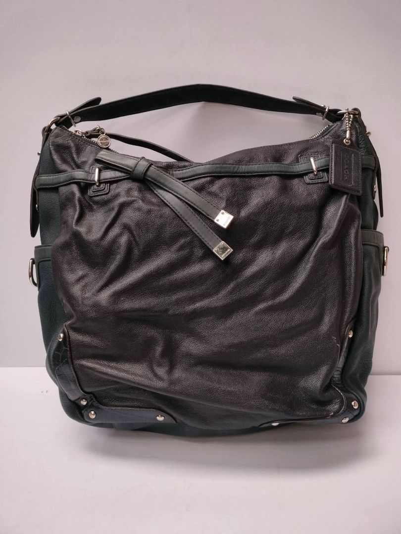 Coach Leather Hobo Bag Dark Green (Category: Luxury Bags & Wallets) located in Baguio. Submitted by galdzz_23 (Listing ID 1469661946, Image 2). Description: - Brand: Coach - Color: Dark green leather with vibrant emerald green satin lining - Hardware: Silver-tone with Coach embossed side logo - Details: Signature hangtag and chic decorative bow strap - Interior: Includes zipper and slip pockets for organization - Design: Comfortable single should