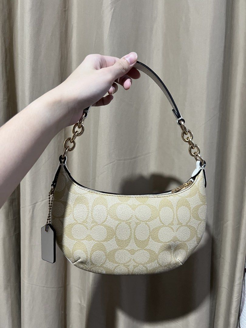 Coach Mini Payton in Signature Canvas (Category: Luxury Bags & Wallets) located in Naga. Submitted by iboninay (Listing ID 1469703816, Image 2). Description: - Authentic Coach signature C canvas shoulder bag - Color: Light khaki/chalk with elegant gold-tone hardware - Rfs: too small for me .