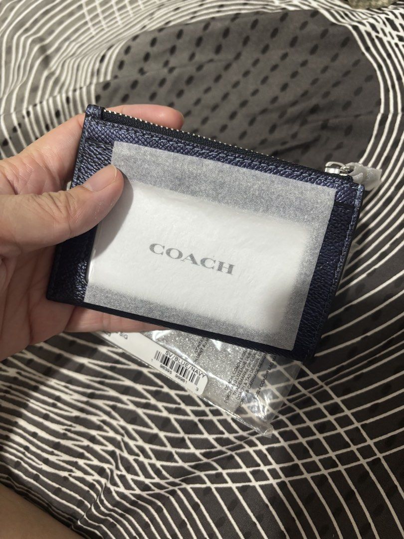 Coach Mini Skinny ID Case (Category: Wallets & Card holders) located in Manila. Submitted by declutter_byjaq (Listing ID 1469577558, Image 2). Description: Coach Women's Mini Skinny ID Case in Signature Canvas, Metallic Leather Card Holder with Key Ring, Blue The Coach Mini Skinny ID Case features signature coated canvas and metallic crossgrain leather in a compact design for everyday use. Its zip-top closure helps keep personal items secure, whi