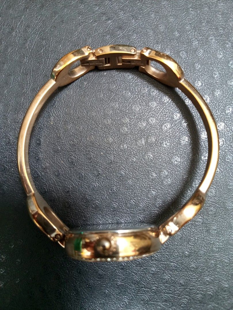 Coach Rose Gold Bangle Watch Crystal Bezel (Category: Women's Watches) located in Malolos. Submitted by lizarondoe59660 (Listing ID 1469541916, Image 3). Description: - Brand: Coach - Style: Bangle watch in rose gold tone - Dial: Round white dial with iconic horse and carriage logo - Bezel: Sparkling crystal pave - Case Back: Stainless steel - Water Resistance: Up to 30 meters - Closure: Clasp with engraved Coach lettering - Movement: Battery-ope