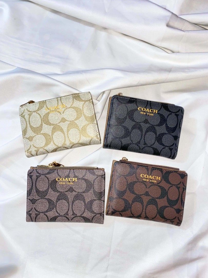 Coach Signature C Bi-fold Zip Wallet (Category: Wallets & Card holders) located in Manila. Submitted by bloomsbeaute (Listing ID 1469744185, Image 1). Description: - Authentic Coach compact wallet with classic signature C monogram - Top zippered compartment for coins and folded cash - Secure snap closure opens to multiple card slots and a clear ID window - Perfectly sized to fit easily into small bags or pockets - Available colors: Metallic Gold,