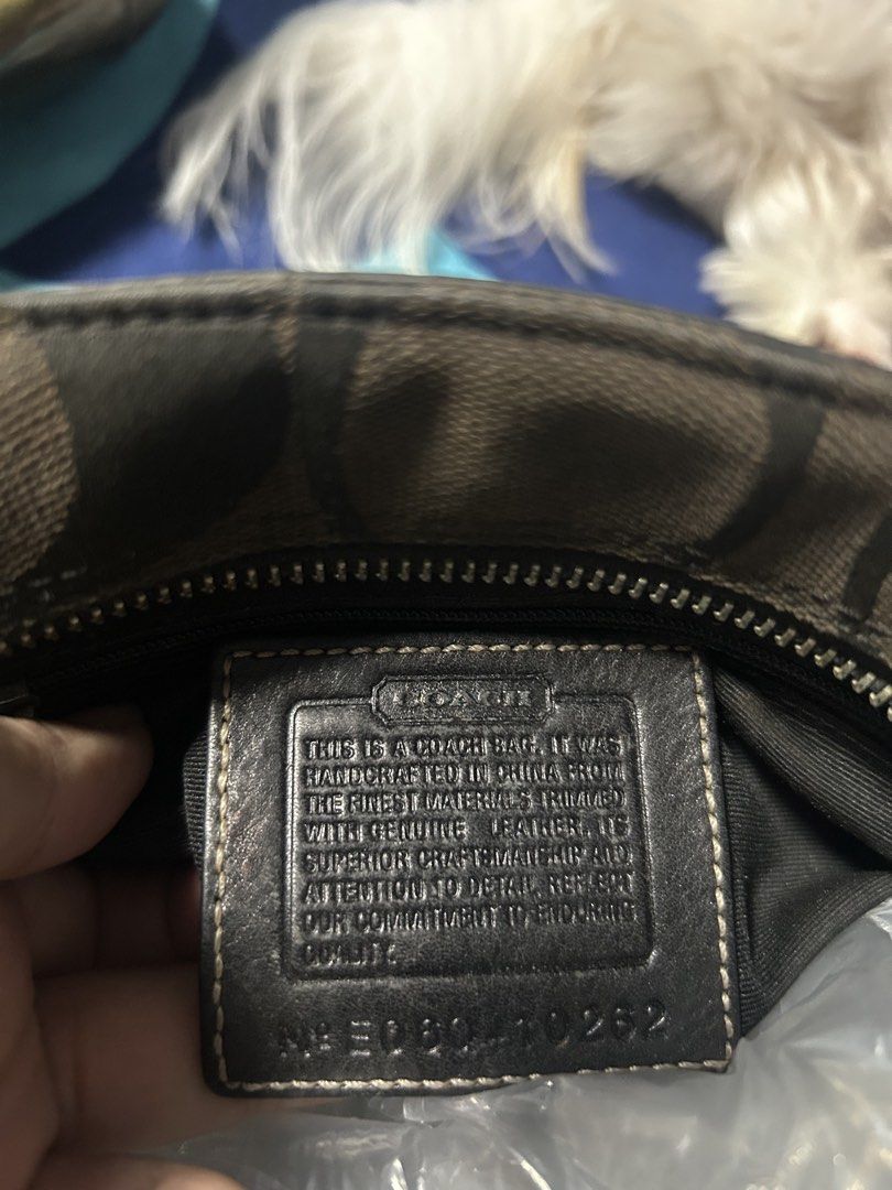 Coach Signature C Python Print Trim Tote Bag (Category: Luxury Bags & Wallets) located in Paombong. Submitted by ofel315 (Listing ID 1469656941, Image 3). Description: - Authentic Coach shoulder bag with iconic signature C canvas and chic black leather panels - Features a bold snakeskin center stripe and polished silver hardware - Secure dog leash closure and comfortable double shoulder straps - Includes a stylish hanging leather tassel charm - C