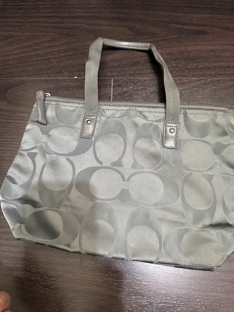 Coach Signature Nylon Tote Bag (Category: Luxury Bags & Wallets) located in Las Pinas. Submitted by nickelcloset (Listing ID 1469607049, Image 2). Description: - Authentic Coach small you can fold - Features the iconic all-over signature C monogram pattern - Secure top zip closure.