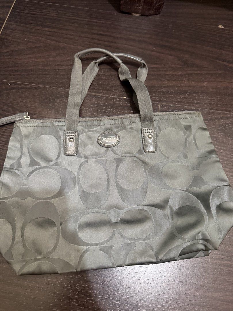 Coach Signature Nylon Tote Bag (Category: Luxury Bags & Wallets) located in Las Pinas. Submitted by nickelcloset (Listing ID 1469607049, Image 1). Description: - Authentic Coach small you can fold - Features the iconic all-over signature C monogram pattern - Secure top zip closure.