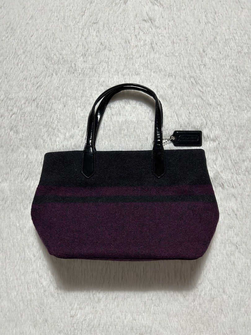 Coach Signature Stripe Wool Tote bag (Category: Tote Bags) located in Quezon City. Submitted by commonwealthpickerph (Listing ID 1469602519, Image 3). Description: Coach Signature Stripe Wool Tote bag Width 12.5 Length 8 - Crafted from cozy grey and purple striped wool - Patent black leather double top handles and matching hangtag - Cute pink enamel Coach logo button on the front - Protective metal feet on the bottom base for durability - Perfect