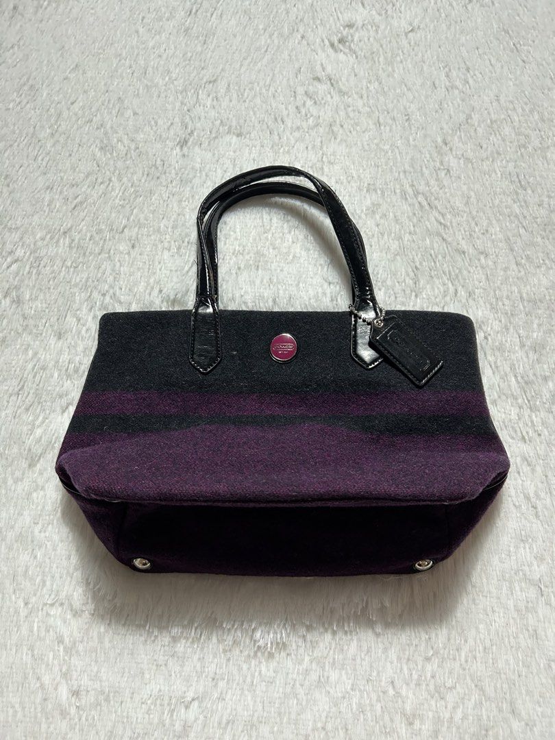 Coach Signature Stripe Wool Tote bag (Category: Tote Bags) located in Quezon City. Submitted by commonwealthpickerph (Listing ID 1469602519, Image 1). Description: Coach Signature Stripe Wool Tote bag Width 12.5 Length 8 - Crafted from cozy grey and purple striped wool - Patent black leather double top handles and matching hangtag - Cute pink enamel Coach logo button on the front - Protective metal feet on the bottom base for durability - Perfect
