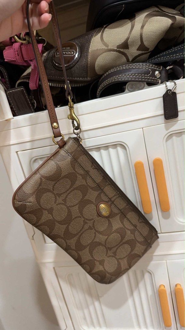 coach wristlet (Category: Clutches) located in Tarlac. Submitted by kryssch (Listing ID 1469658932, Image 1). Description: shipping via j&t .