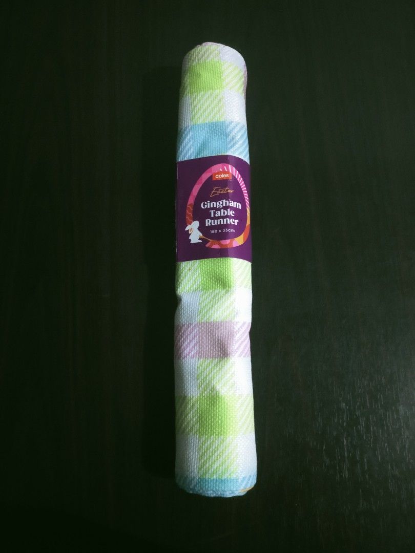 Coles Easter Gingham Table Runner (Category: Other Home Decor) located in Quezon City. Submitted by mcmp1216 (Listing ID 1469678052, Image 1). Description: Brand: Coles Product: Easter Gingham Table Runner Size: 180 cm x 33 cm (approx. 71" x 13") Design: Pastel plaid pattern in shades of pink, green, blue, yellow, and white with seasonal Easter branding. Brand New 💯.