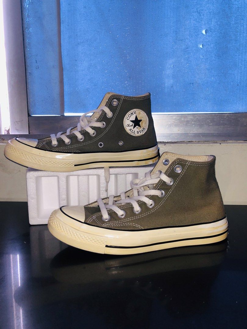 Converse Chuck 70 High Top Green Size Men 6 (Category: Sneakers) located in San Mateo. Submitted by railiam (Listing ID 1469718988, Image 1). Description: - Brand: Converse Chuck 70 High Top - Color: Olive Green with contrast stitching - Style Number: 162052C (verified on interior tag) - Details: Classic canvas upper, white laces, glossy off-white midsole with black piping, and vintage heel license plate - Sizing: Unisex - Condition: Clean overal