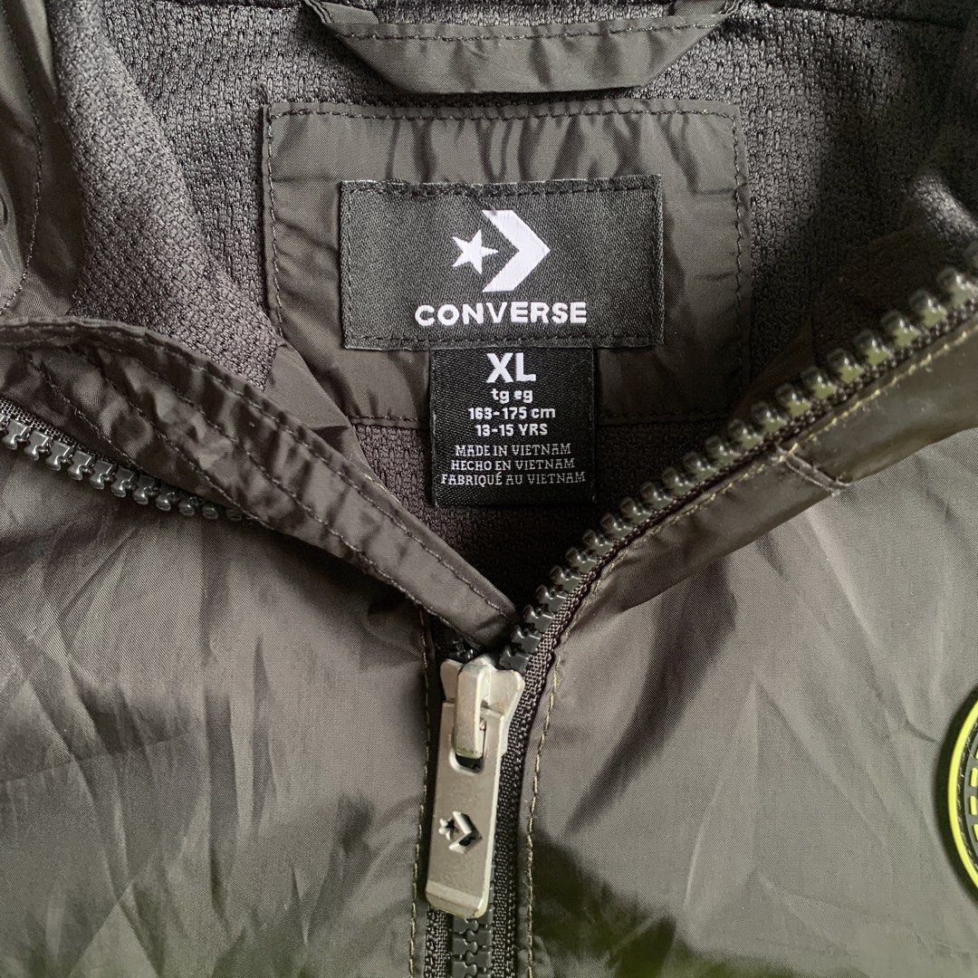Converse Hooded Windbreaker Jacket (Category: Coats, Jackets and Outerwear) located in Manila. Submitted by xumiiyea (Listing ID 1469584467, Image 2). Description: Converse Zip-up windbreaker with hood XL (Recommended for youth ages 13-15 years, height 163-175 cm) Black and olive green colorblock with neon yellow stripe Full zip closure, lightweight material, breathable mesh lining Branded taping on chest, bold Converse text printed on hood and s