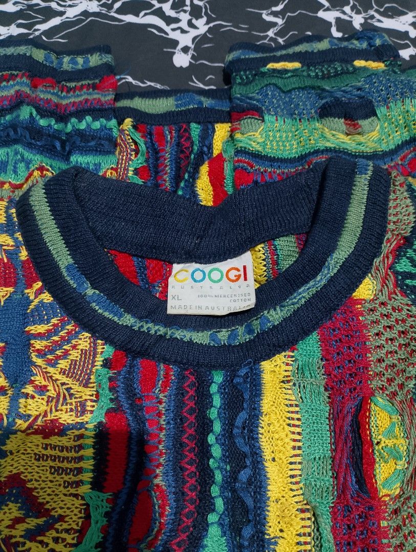 Coogi Australia 3D Knit Sweater Multicolour (Category: Coats, Jackets and Outerwear) located in Zamboanga. Submitted by titoboy_thrift (Listing ID 1469622723, Image 3). Description: - Authentic vintage Coogi Australia crewneck sweater - Heavy textured 3D knit with intricate multi-color pattern - Classic 90s baggy silhouette - Deep navy collar, cuffs, and hem ribbing - Vibrant mix of red, yellow, green, and blue threads - Perfect statement piece f