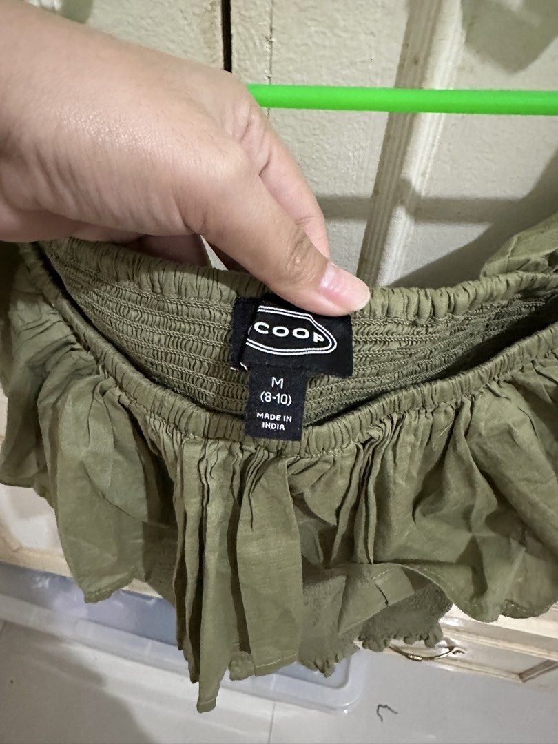 COOP Smocked Ruffle Top Green Mist Size M (Category: Sleeveless) located in Bugallon. Submitted by lavenderlane (Listing ID 1469709912, Image 2). Description: - Brand: Coop - Size: M (8-10) - Condition: Brand new with original tag attached - Material: Super comfy and stretchy - Design: Square neckline, short ruffle sleeves, smocked bodice - Color: Green - Perfect for casual days out.