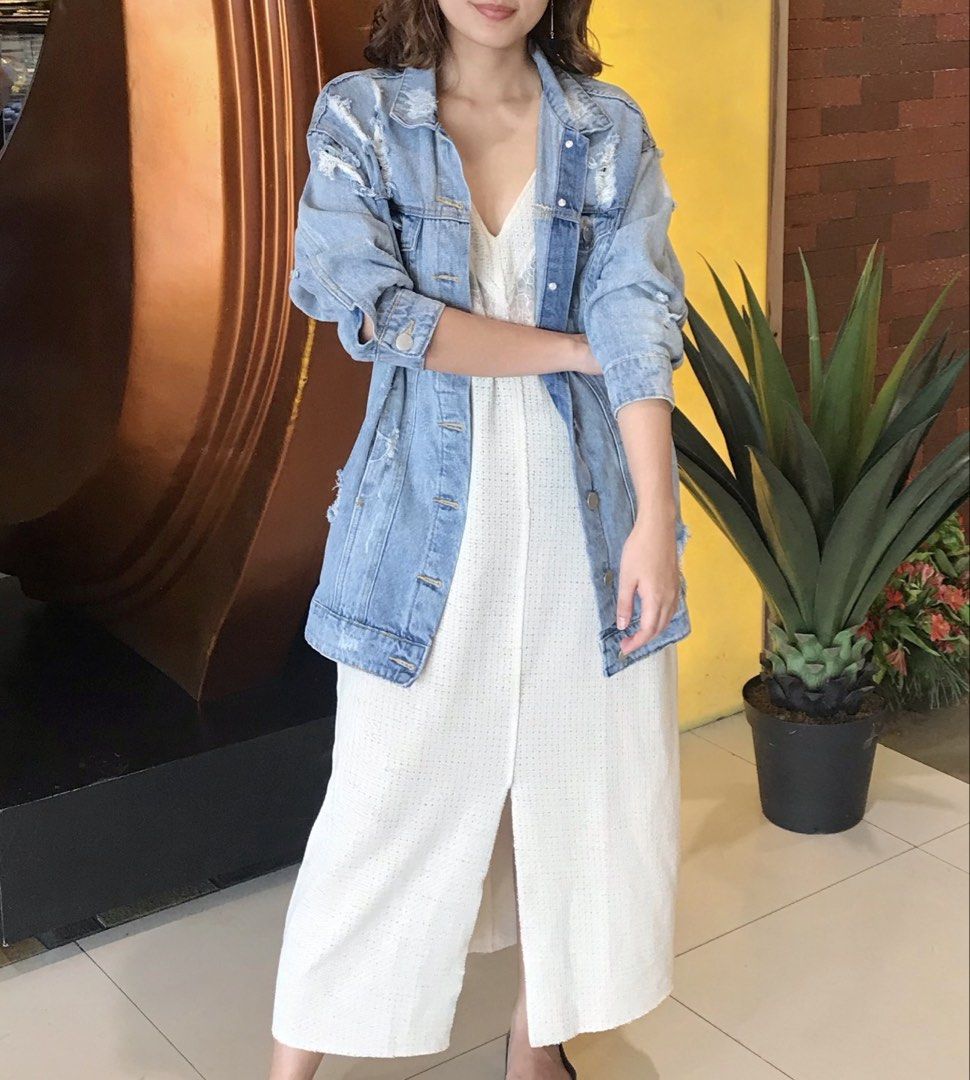 Cotton On Distressed Denim Jacket Size AUS 10 (Category: Coats, Jackets and Outerwear) located in Calamba. Submitted by cheriiv (Listing ID 1469724458, Image 1). Description: - Brand: Cotton On - Style: Light wash denim jacket with heavy distressing on shoulders and back hem - Fit: Oversized, perfect for layering - Details: Button-up front, silver hardware, chest pockets, and side pockets - Size: AUS 10, US 6, EUR 38 (Medium).