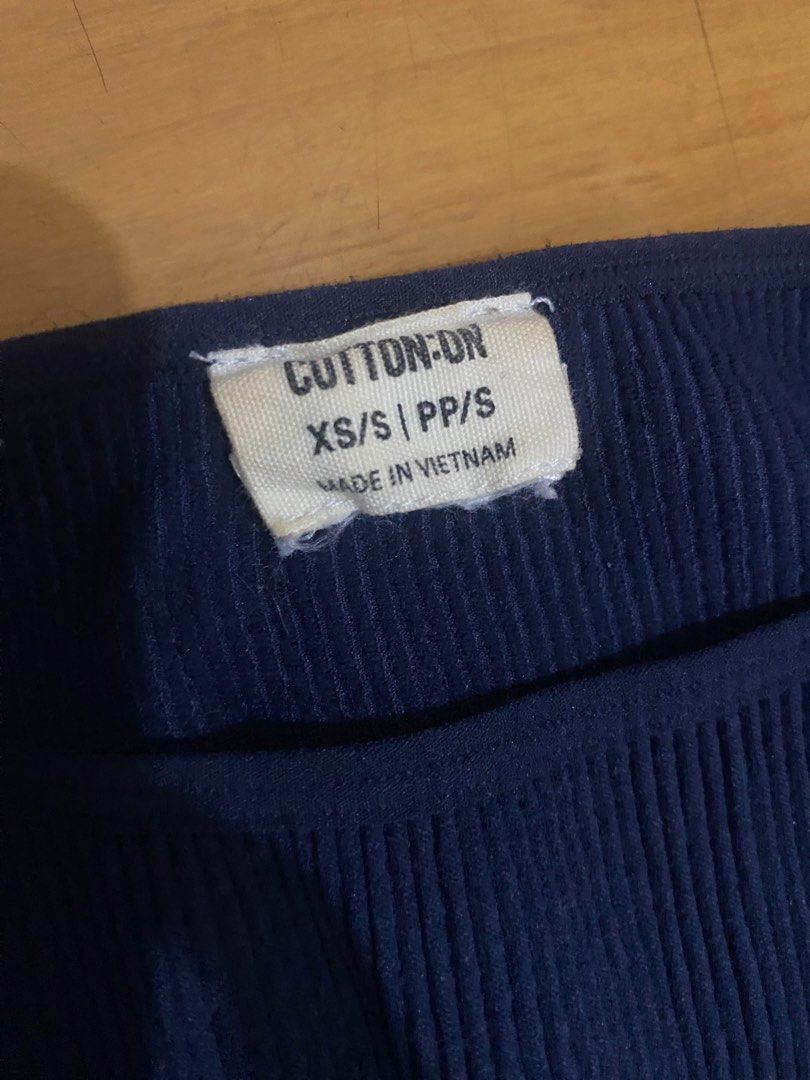 Cotton On Ribbed Navy Blue Tank Top (Category: Sleeveless) located in Marikina City. Submitted by ctgccc (Listing ID 1469694287, Image 2). Description: - Brand: Cotton On - Color: Navy blue - Size: XS/S - Material: Stretchy ribbed fabric - Origin: Made in Vietnam - Style: Sleeveless basic, great for layering or standalone wear.