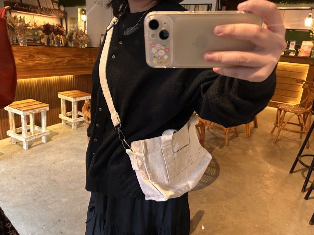 Cream sling bag (Category: Cross-body Bags) located in Cagayan de Oro. Submitted by dreisellsnbuys (Listing ID 1469652514, Image 2). Description: No zipper but with small outer pocket, slight lipstick stain on the inside..