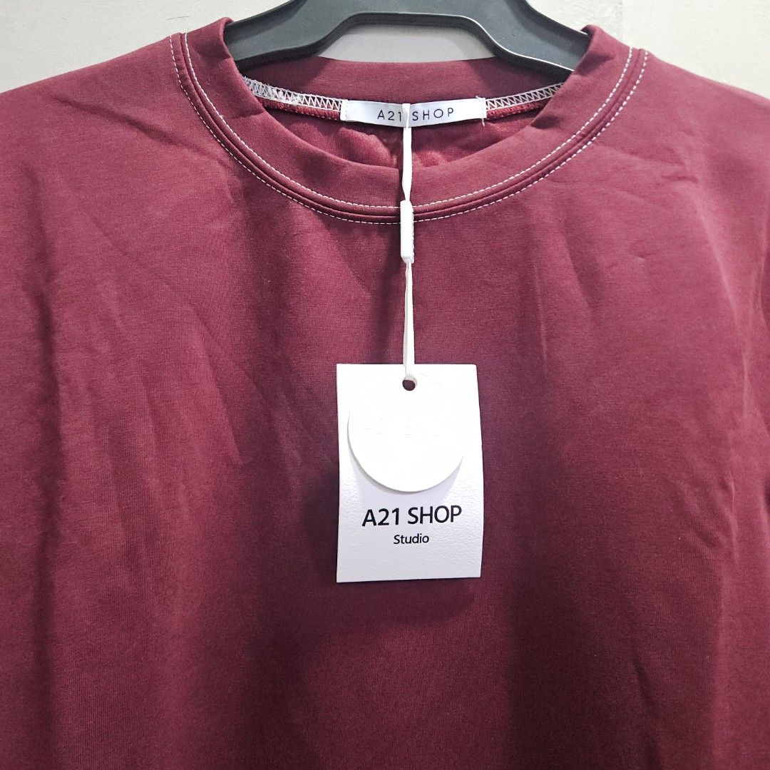 Crewneck 3/4 balloon sleeves top (Category: Others Tops) located in Quezon City. Submitted by k_closetsale (Listing ID 1469643812, Image 2). Description: wine-colored crewneck oversized top featuring 3/4 balloon sleeves with pleated cuffs and contrast white stitching, branded by A21 Shop Studio fits up to XL.