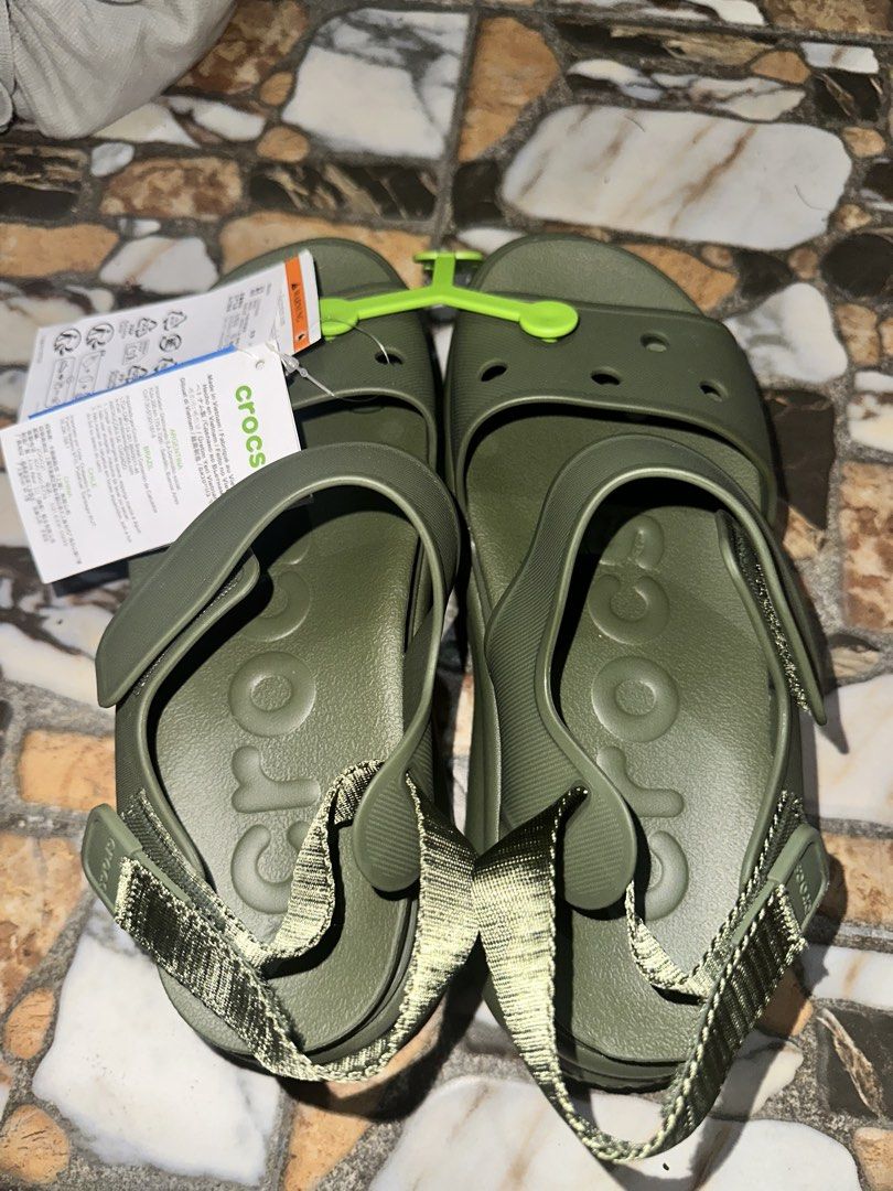 Crocs Soho Y Strap Olive Green Size W7 US (Category: Flats & Sandals) located in Bugallon. Submitted by lavenderlane (Listing ID 1469674559, Image 1). Description: - Brand: Crocs - Condition: Brand new with tags (BNWT), never worn - Color: Olive green - Size: Women's W7 / EU 37-38 - Features: Adjustable heel strap, lightweight design, and classic molded footbed for comfort.