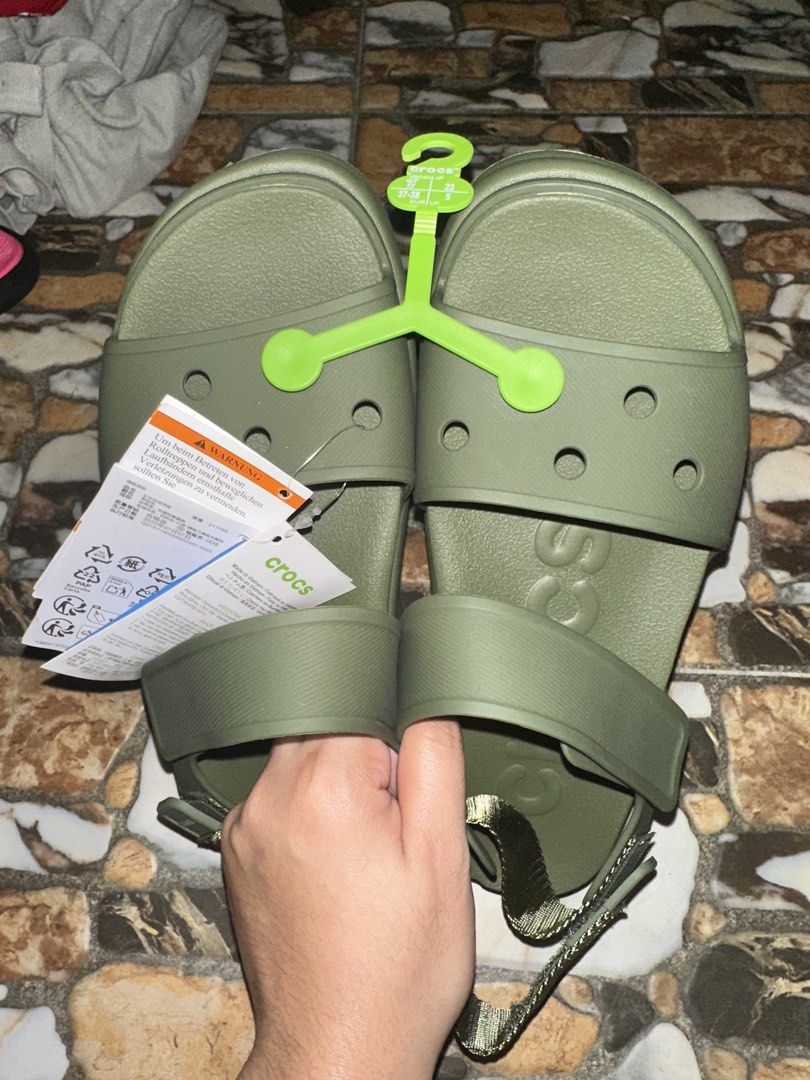 Crocs Soho Y Strap Olive Green Size W7 US (Category: Flats & Sandals) located in Bugallon. Submitted by lavenderlane (Listing ID 1469674559, Image 2). Description: - Brand: Crocs - Condition: Brand new with tags (BNWT), never worn - Color: Olive green - Size: Women's W7 / EU 37-38 - Features: Adjustable heel strap, lightweight design, and classic molded footbed for comfort.