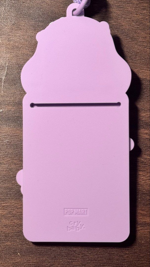 Cry Baby ID lace (Category: Plushies & Soft Toys) located in Makati City. Submitted by khyfra25 (Listing ID 1469631662, Image 2). Description: - Authentic Pop Mart Cry Baby design - Color: Pastel purple with mint accents - Material: Durable and soft rubber/silicone card holder with a sturdy woven lanyard - Condition: Brand new - Features adorable Cry Baby character graphics with floral details - Ideal for office IDs, school badges, or transit car