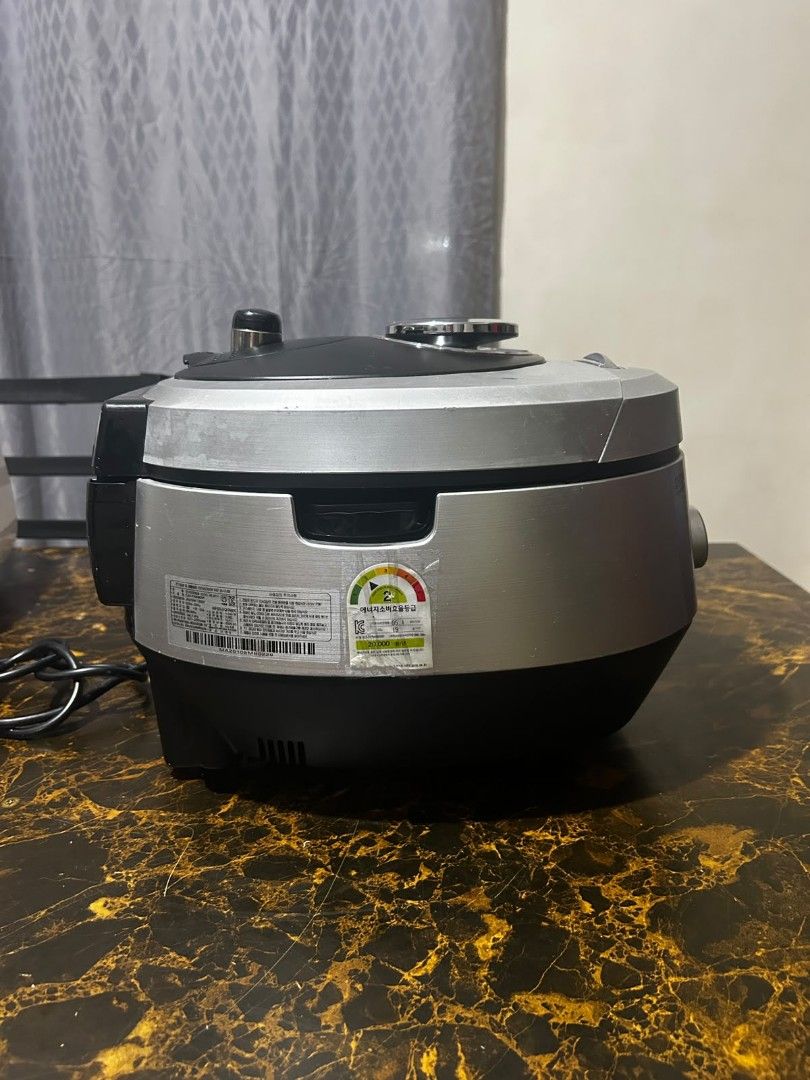 Cuchen IH Pressure Rice Cooker (Category: Cookers) located in Taguig. Submitted by lhadychinitah (Listing ID 1469679670, Image 2). Description: - Brand: Cuchen - Model: CJH-PA0680SK - Type: IH Pressure Rice Cooker - Origin: Made in Korea - Features: Easy Jog Dial System, digital display, multiple cooking functions - Condition: Pre-owned with minor cosmetic wear, fully functional.