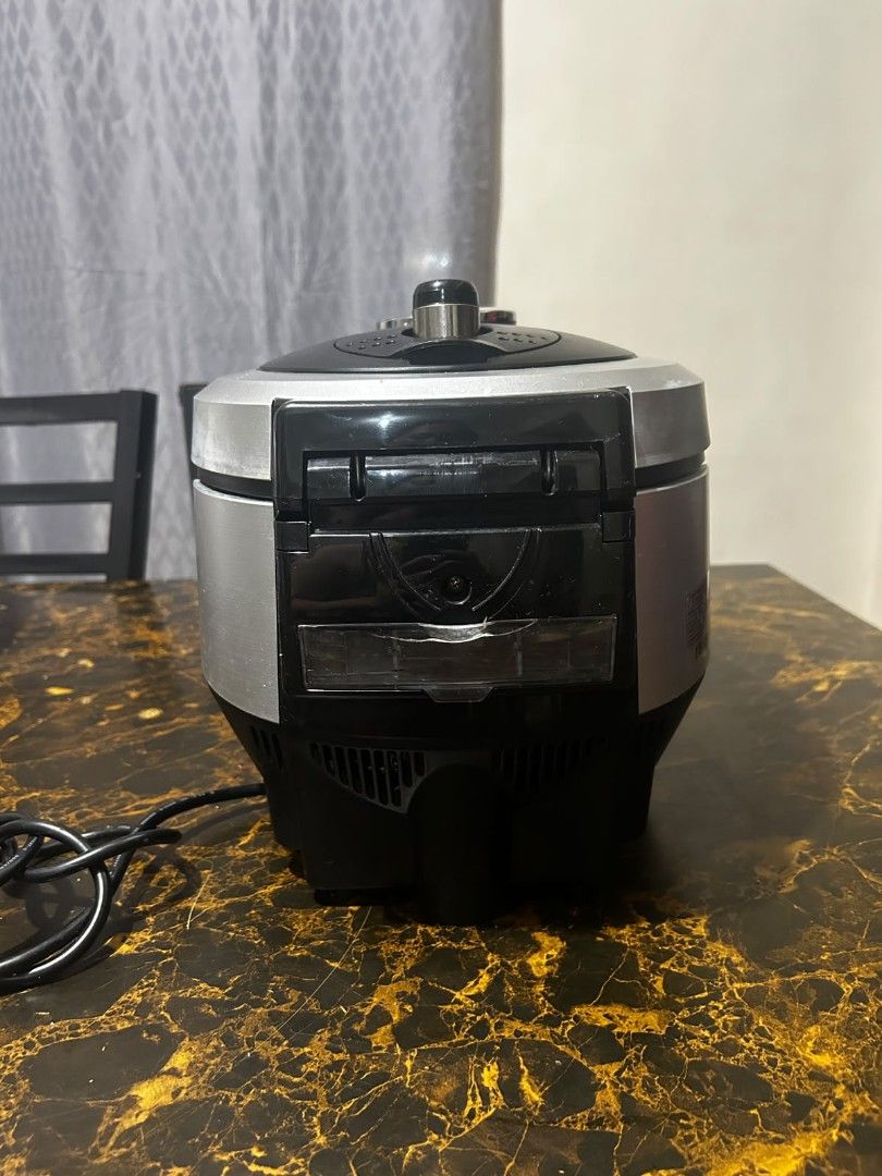 Cuchen IH Pressure Rice Cooker (Category: Cookers) located in Taguig. Submitted by lhadychinitah (Listing ID 1469679670, Image 3). Description: - Brand: Cuchen - Model: CJH-PA0680SK - Type: IH Pressure Rice Cooker - Origin: Made in Korea - Features: Easy Jog Dial System, digital display, multiple cooking functions - Condition: Pre-owned with minor cosmetic wear, fully functional.