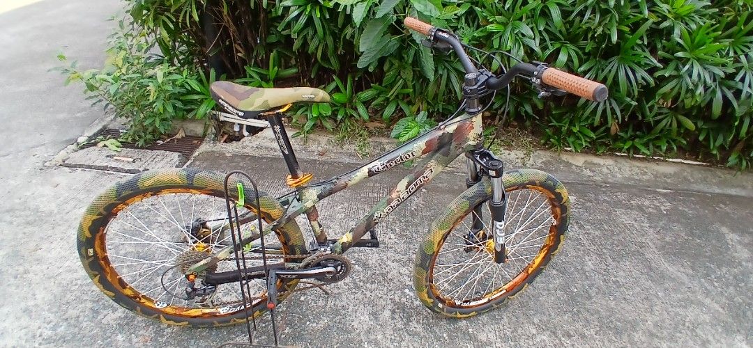Da bomb MTB 26er (Category: Bicycles) located in Marikina City. Submitted by darthvader888 (Listing ID 1469636349, Image 1). Description: Frame: Authentic Da Bomb Ejector (Classic, bomb-proof 14" aluminum DJ frame) • Tires: Highly sought-after Cult x Vans Waffle Camo Tires 26x2.10 (Excellent tread life) • Wheelset: Da Bomb Camo Rims laced to loud, crisp Gold Anodized Hubs • Gears: Reliable, crisp 1x9 Speed Shimano Alivio Drivetrain setup • Cockpi