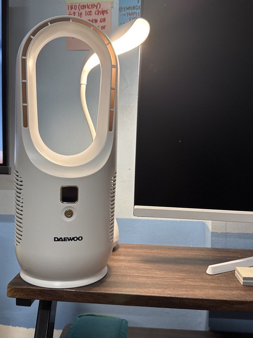 Daewoo Bladeless Desk Fan (Category: Fans) located in Makati City. Submitted by khyfra25 (Listing ID 1469635279, Image 3). Description: - Daewoo bladeless tower fan in a clean white, modern oval design - Features a digital display screen showing battery percentage - Easy-to-use single power button located right below the screen - Convenient pluggable charging cable attached on the right side - Compact and space-saving, sits easily on any desk or 