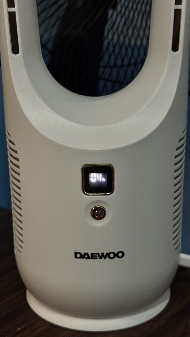 Daewoo Bladeless Desk Fan (Category: Fans) located in Makati City. Submitted by khyfra25 (Listing ID 1469635279, Image 2). Description: - Daewoo bladeless tower fan in a clean white, modern oval design - Features a digital display screen showing battery percentage - Easy-to-use single power button located right below the screen - Convenient pluggable charging cable attached on the right side - Compact and space-saving, sits easily on any desk or 