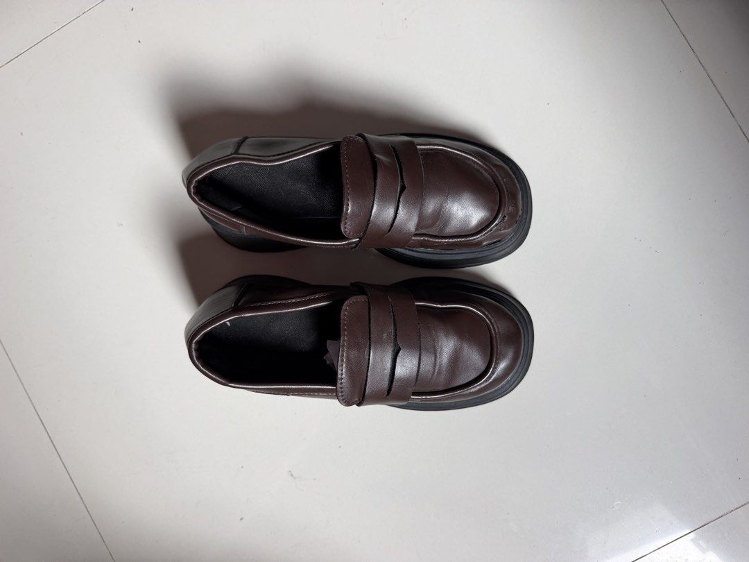 Dark brown chunky platform loafers with heels (Category: Loafers) located in Batangas. Submitted by bebot943 (Listing ID 1469588929, Image 3). Description: - Color: Dark brown - Style: Slip-on chunky loafers with thick lug soles and chunky heels - Size: 36 - Condition: Minor scuffing on one front toe area and light wear on soles - Perfect for adding an edgy touch to any casual or smart outfit!.
