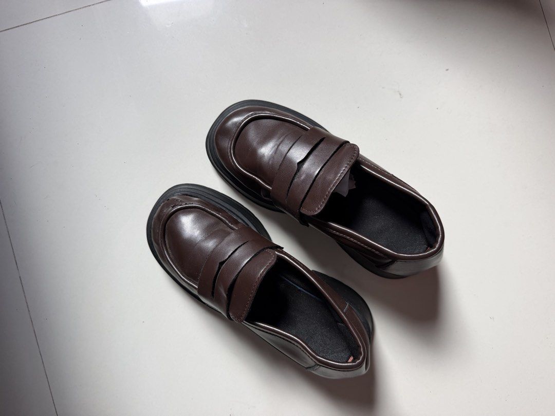 Dark brown chunky platform loafers with heels (Category: Loafers) located in Batangas. Submitted by bebot943 (Listing ID 1469588929, Image 2). Description: - Color: Dark brown - Style: Slip-on chunky loafers with thick lug soles and chunky heels - Size: 36 - Condition: Minor scuffing on one front toe area and light wear on soles - Perfect for adding an edgy touch to any casual or smart outfit!.