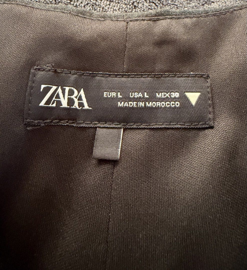 Dark Gray Peplum Top - Zara (Category: Blouses) located in Pasig City. Submitted by caroline111 (Listing ID 1469630743, Image 2). Description: Sleeveless Fits M-L.