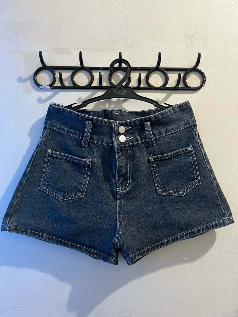 Dark wash denim shorts with front pockets (Category: Shorts) located in Manila. Submitted by vin_take (Listing ID 1469682531, Image 1). Description: - Style: High-waisted dark wash denim shorts with a clean hem - Details: Contrast stitching, two front flap pockets, and double silver button closure - Fit: Flattering high-rise cut - Versatility: Easy to pair with tanks, tees, or hoodies for a casual summer look - Condition: Brand new / Excellent (r