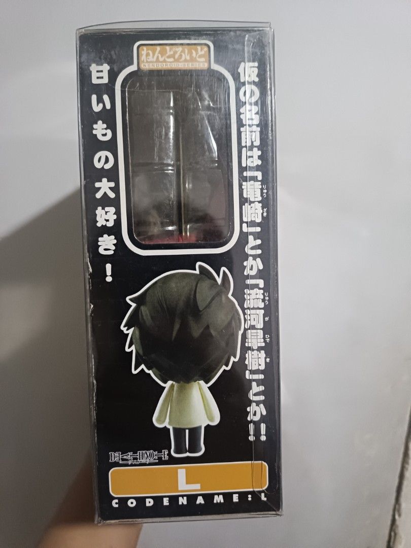 Death Note L Nendoroid Figure 17 (Category: Figurines & Statues) located in Manila. Submitted by wah2895 (Listing ID 1469603843, Image 2). Description: - Authentic Good Smile Company Death Note L Nendoroid (Figure #17) - Includes iconic red chair, multiple interchangeable faceplates, phone, and handcuffs - Comes with original box featuring official branding and Japanese text - Perfect collectible item for anime fans and figure collectors - Well-m