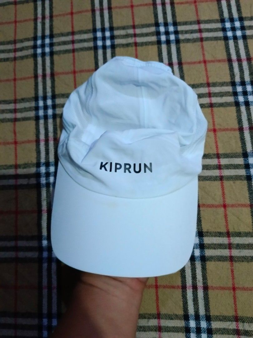 Decathlon Kiprun Running Cap White (Category: Caps & Hats) located in General Santos City (Dadiangas). Submitted by freehorse.5f2a61 (Listing ID 1469630368, Image 1). Description: - Brand: Decathlon Kiprun - Color: White - Material: Lightweight, breathable fabric with side mesh panels for ventilation - Closure: Adjustable strap with black buckle - Details: Model number 352661 on interior tag - Condition: Excellent, ready for workouts or daily wea
