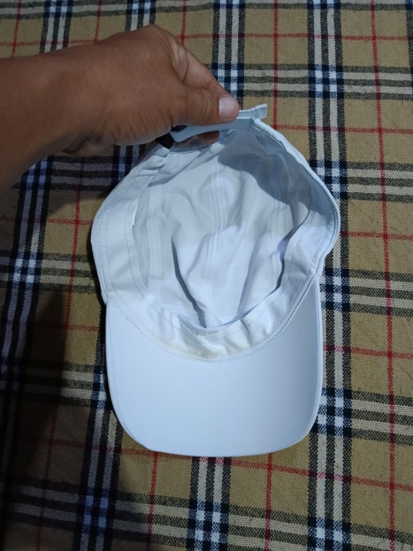 Decathlon Kiprun Running Cap White (Category: Caps & Hats) located in General Santos City (Dadiangas). Submitted by freehorse.5f2a61 (Listing ID 1469630368, Image 3). Description: - Brand: Decathlon Kiprun - Color: White - Material: Lightweight, breathable fabric with side mesh panels for ventilation - Closure: Adjustable strap with black buckle - Details: Model number 352661 on interior tag - Condition: Excellent, ready for workouts or daily wea