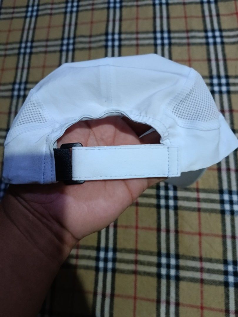 Decathlon Kiprun Running Cap White (Category: Caps & Hats) located in General Santos City (Dadiangas). Submitted by freehorse.5f2a61 (Listing ID 1469630368, Image 2). Description: - Brand: Decathlon Kiprun - Color: White - Material: Lightweight, breathable fabric with side mesh panels for ventilation - Closure: Adjustable strap with black buckle - Details: Model number 352661 on interior tag - Condition: Excellent, ready for workouts or daily wea