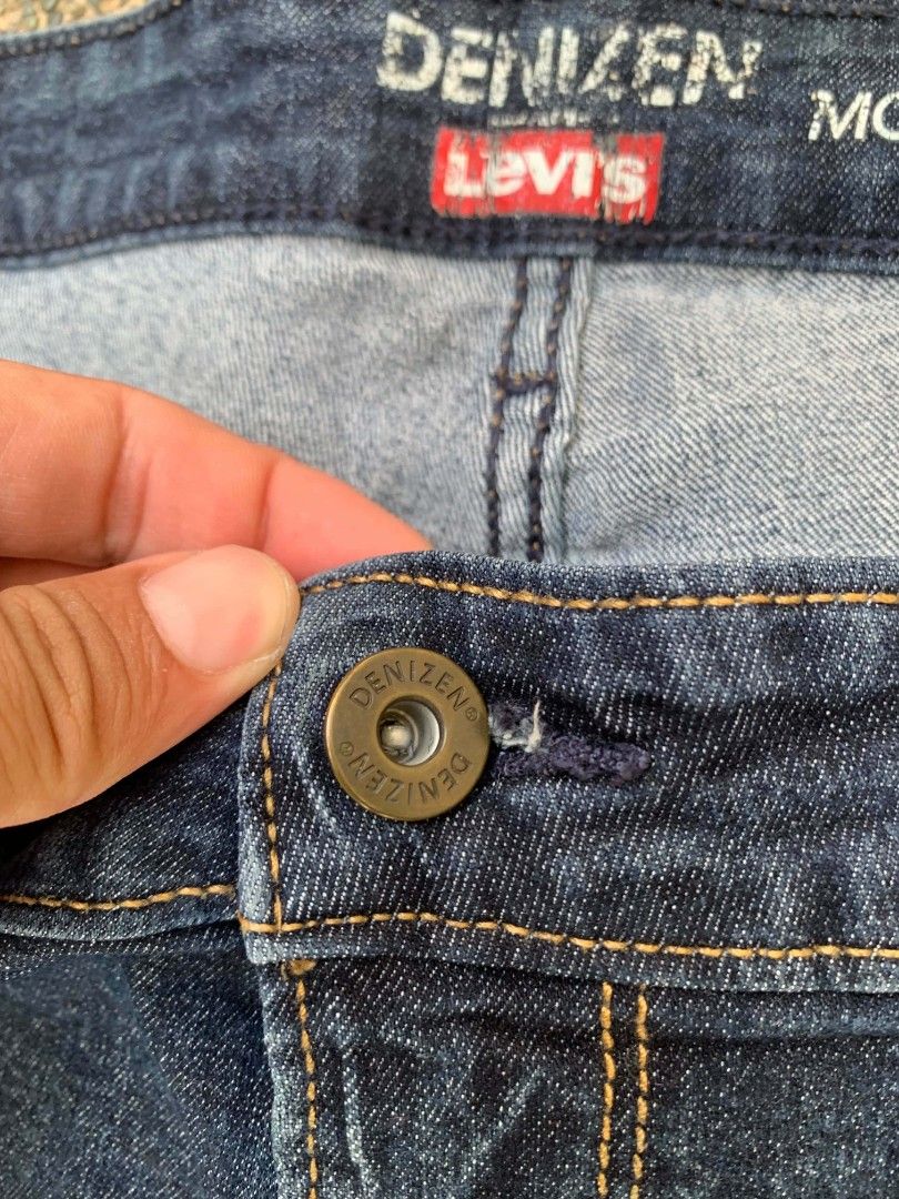 Denizen from Levi's Modern Bootcut Jeans (Category: Jeans) located in Manila. Submitted by reiyangelow (Listing ID 1469592886, Image 3). Description: - Brand: Denizen from Levi's - Style: Modern bootcut - Color: Dark wash blue - Design: Classic five-pocket style with branded hardware (button and rivets) - Details: Signature back pocket stitching and back patch - Size: Waist measures approx. 18 inches across (laid flat) - Condition: Great for ever