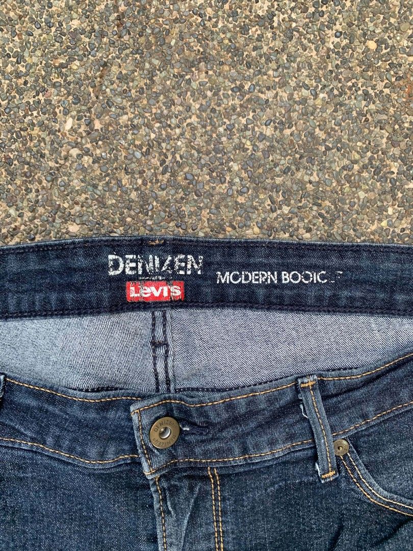 Denizen from Levi's Modern Bootcut Jeans (Category: Jeans) located in Manila. Submitted by reiyangelow (Listing ID 1469592886, Image 2). Description: - Brand: Denizen from Levi's - Style: Modern bootcut - Color: Dark wash blue - Design: Classic five-pocket style with branded hardware (button and rivets) - Details: Signature back pocket stitching and back patch - Size: Waist measures approx. 18 inches across (laid flat) - Condition: Great for ever