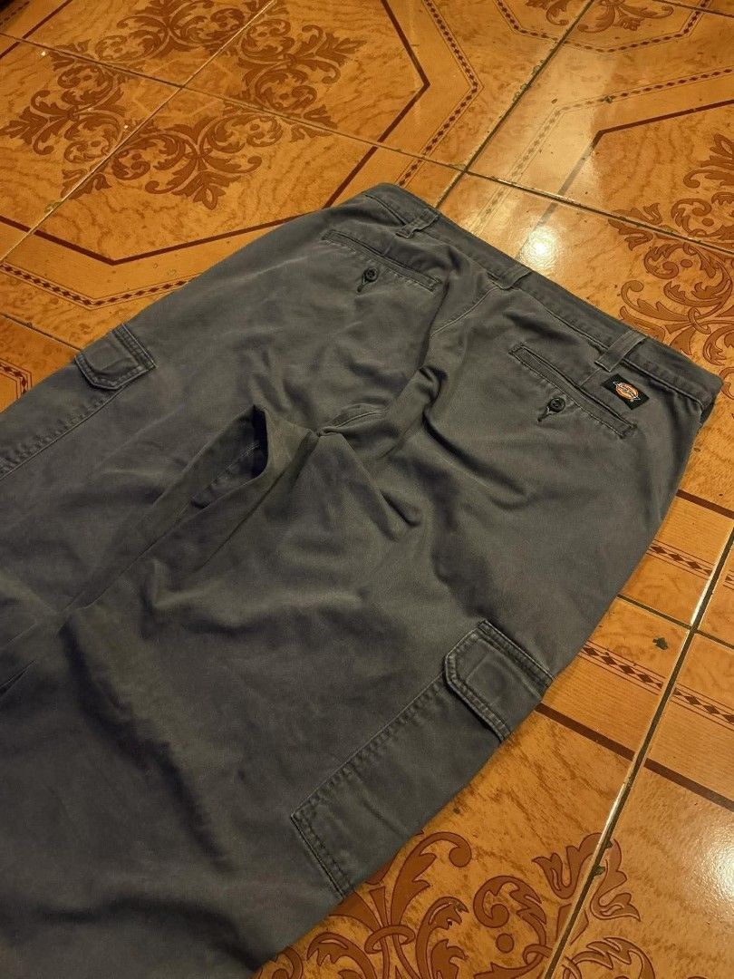 Dickies Cargo Pants Grey Size 34x32 (Category: Trousers) located in Manila. Submitted by cualesdyla42584 (Listing ID 1469658001, Image 2). Description: - Brand: Dickies - Color: Dark Grey - Size: 34x32 - Material: Sturdy, durable cotton - Pockets: Multiple utility cargo pockets and standard back pockets with button closures - Fastening: Zip fly with waist button closure - Condition: Excellent, ready to wear 36x42 cargo need wash Issue - heeldrag 