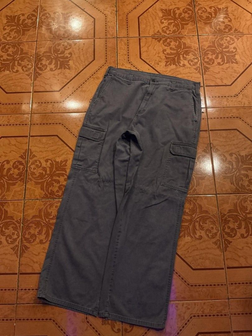 Dickies Cargo Pants Grey Size 34x32 (Category: Trousers) located in Manila. Submitted by cualesdyla42584 (Listing ID 1469658001, Image 3). Description: - Brand: Dickies - Color: Dark Grey - Size: 34x32 - Material: Sturdy, durable cotton - Pockets: Multiple utility cargo pockets and standard back pockets with button closures - Fastening: Zip fly with waist button closure - Condition: Excellent, ready to wear 36x42 cargo need wash Issue - heeldrag 