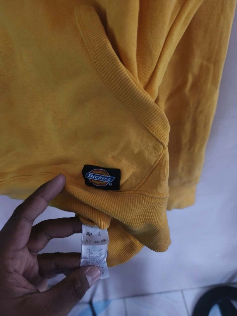 Dickies Yellow Hoodie XL (Category: Coats, Jackets and Outerwear) located in Manila. Submitted by cookthrift (Listing ID 1469575953, Image 3). Description: - Brand: Dickies - Size: XL - Color: Vibrant yellow with a bold blue framed chest logo - Material: Comfortable cotton blend - Features: Kangaroo pocket, drawstring hood, branded inner neck taping, and a small woven logo tag near the hem size XL Very good condition sunfade.