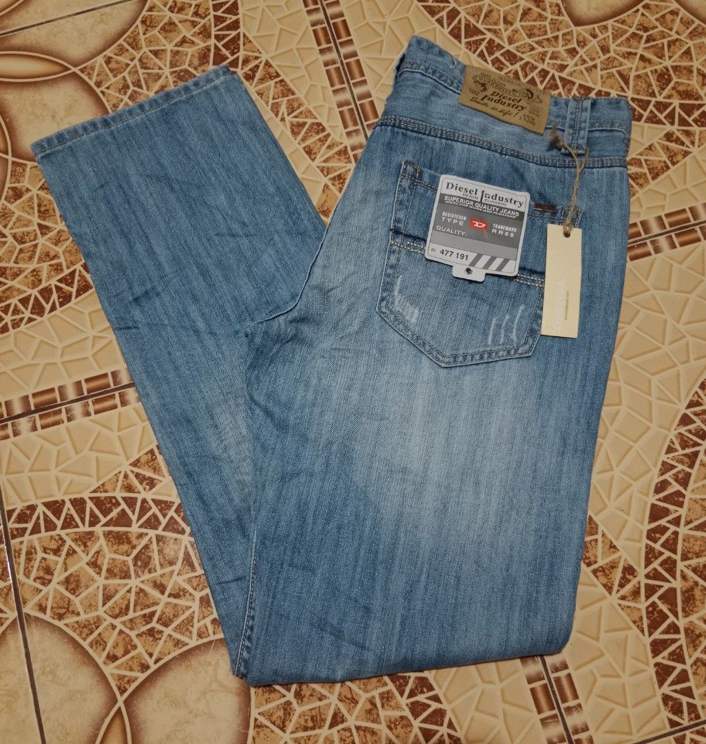 Diesel Industry Denim Division Jeans (Category: Jeans) located in Toledo. Submitted by zealzionta54269 (Listing ID 1469653809, Image 2). Description: - Brand: Diesel Industry -size 36 - Wash: Light wash with subtle distressing - Fit: Classic straight leg - Details: Branded metal buttons and classic leather patch on the back waistband - Condition: Brand new with original tags attached (Type RR55, No. 477 191) - Perfect for daily wear and casual st