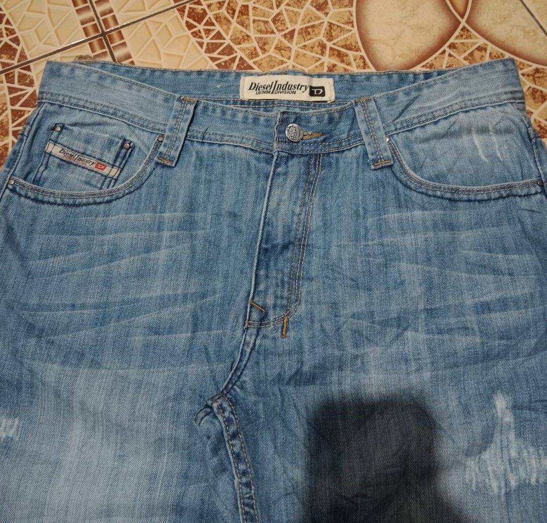 Diesel Industry Denim Division Jeans (Category: Jeans) located in Toledo. Submitted by zealzionta54269 (Listing ID 1469653809, Image 3). Description: - Brand: Diesel Industry -size 36 - Wash: Light wash with subtle distressing - Fit: Classic straight leg - Details: Branded metal buttons and classic leather patch on the back waistband - Condition: Brand new with original tags attached (Type RR55, No. 477 191) - Perfect for daily wear and casual st